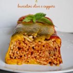 Timballo di peperoni e bucatini olive e capperi